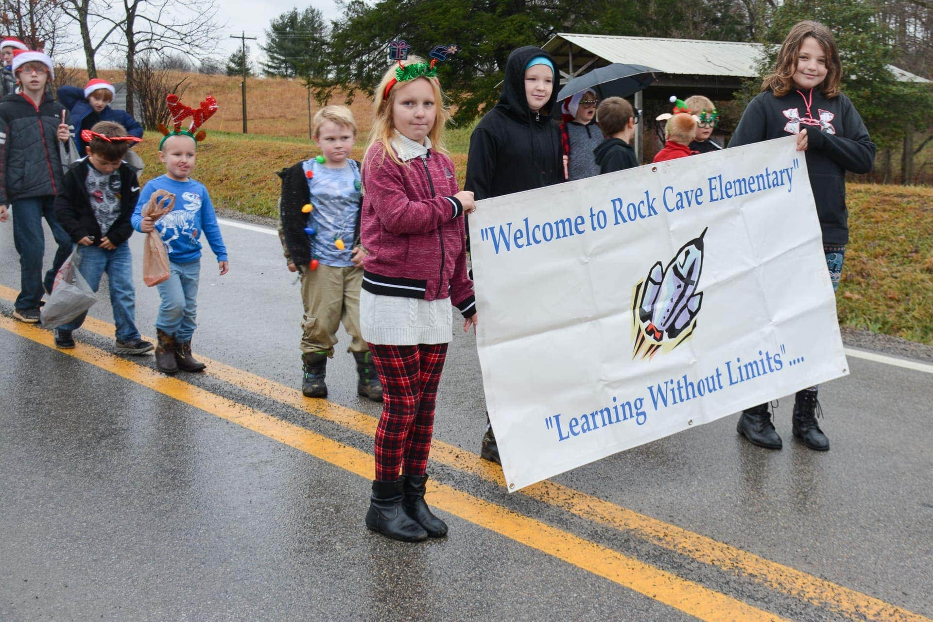 Santa opts for covered sleigh at rainy Rock Cave Christmas parade My