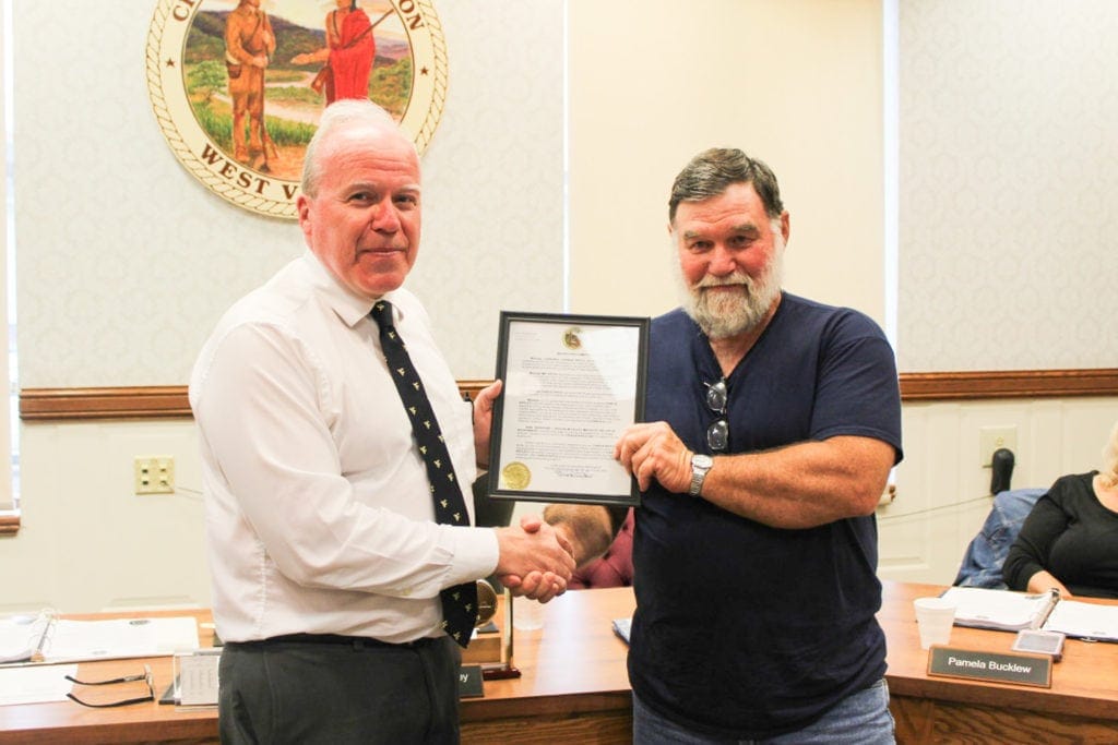Mayor David McCauley recognizes retirning city employee Charlie Riffle.
