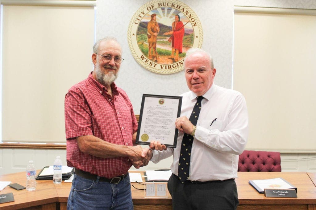 Mayor David McCauley recognizes retirning city employee Melvin Smith.