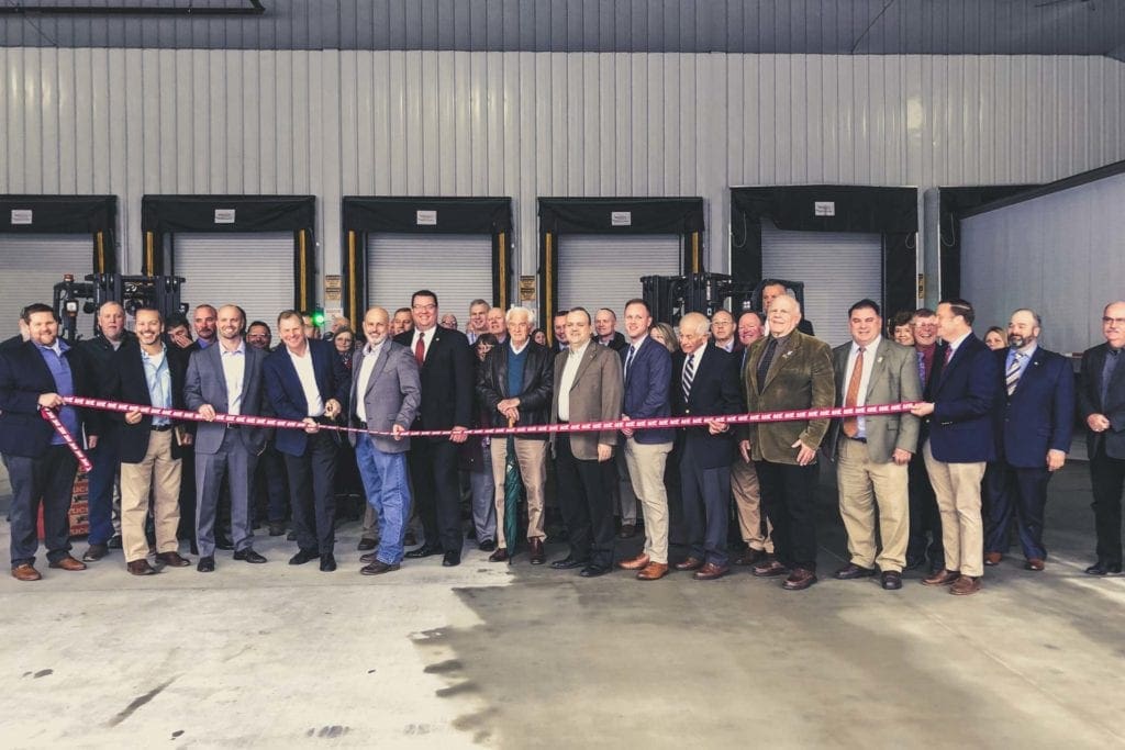 AHF Products CEO and President, Brian Carson, and AHF Beverly Plant Manager, Blaine Emery, are joined by federal, state, and local elected officials, economic development, and business representatives to cut the ribbon on the plant’s completed expansion. 