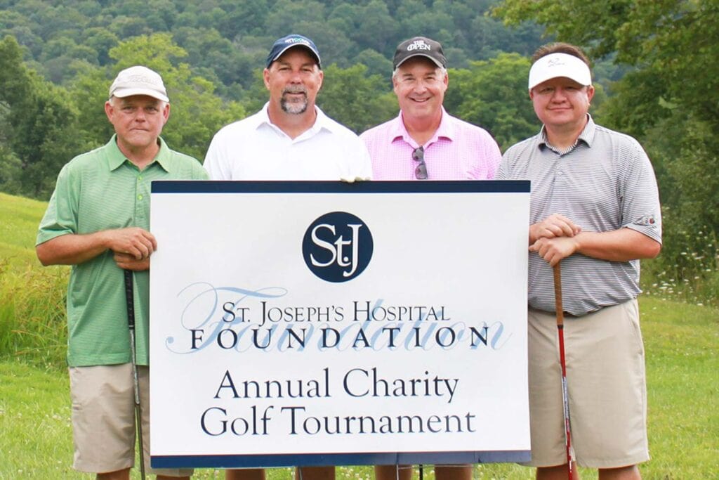 Second Place: Edward Jones with players Robin Bailey and Jason Gruse and Encova Insurance with players John France and David Walker.