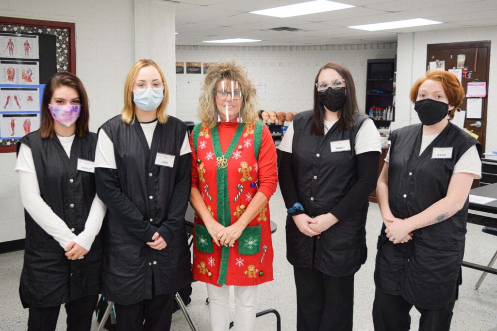 Fred Eberle Technical Center cosmetology coordinator Mary Hull is pictured with cosmetology students Ashley White, Lexy Wildman, Mindy Hayes and Katie Smith.