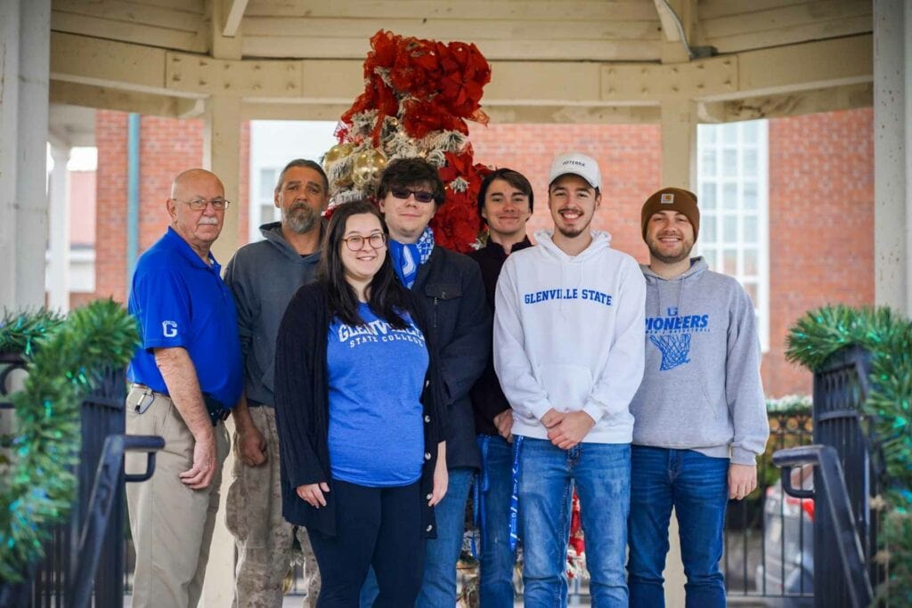 (l-r) Dennis Fitzpatrick, Dave Kennedy, Hannah Rexroad, Garrett Watts, Cody Dye, Nic McVaney, and Conner Ferguson recently spent time hanging Christmas decorations in Downtown Glenville.
