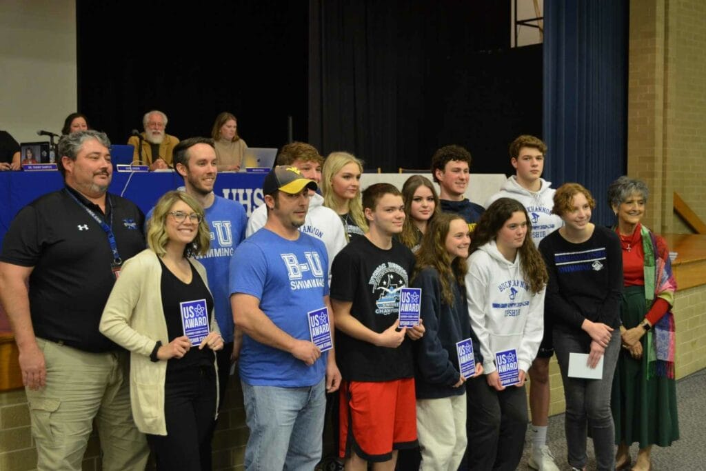 Buckhannon-Upshur High School swimming team state qualifiers and their coaches receive Upshur Stars during Tuesday’s Upshur County Board of Education meeting. Girls State Qualifiers in swimming include Lillian Fetty, Riley Vincent, Cadence Vincent, Alayna Whitehair and Cameron Zuliani. Boys State Qualifiers in swimming include Owen Caynor, Reis Leonard, Preston Bennett and Carter Zuliani. The B-UHS head swimming coach is Michael Roessing and assistant coaches are Will Squires and Brittany Squires. Upshur Stars were presented to qualifiers and coaches by Upshur County Schools Assistant Superintendent Dr. Debra Harrison.