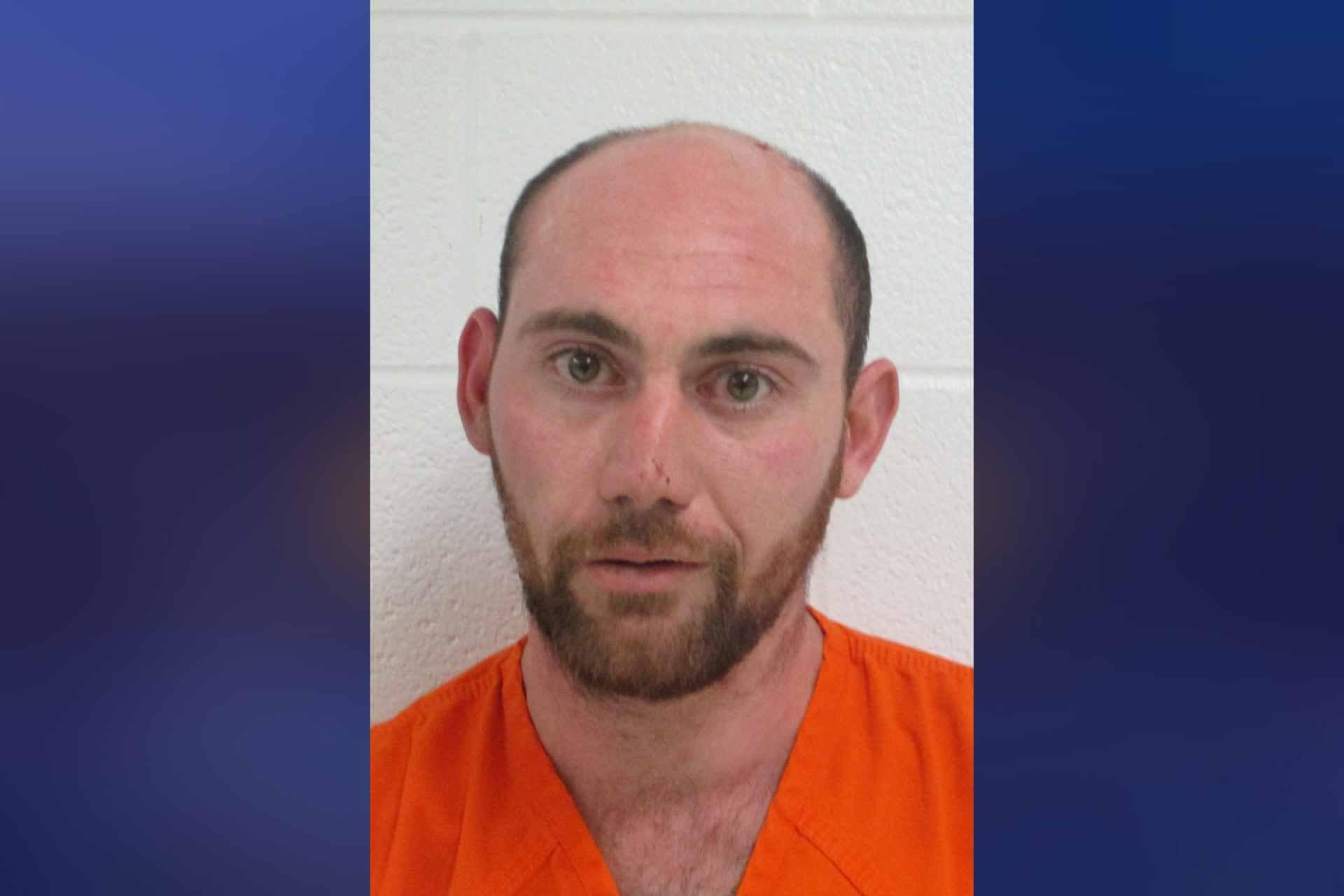 Rock Cave man arrested for allegedly threatening police officer's family